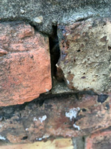 close up view of bricks with missing mortar